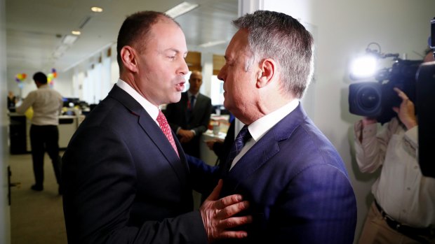 Environment and Energy Minister Josh Frydenberg debates coal policy with Labor MP Joel Fitzgibbon in the press gallery.