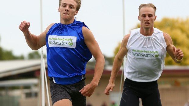 Victor: Isaac Dunmall (left) etched his name into history in winning the Stawell Gift on Monday.