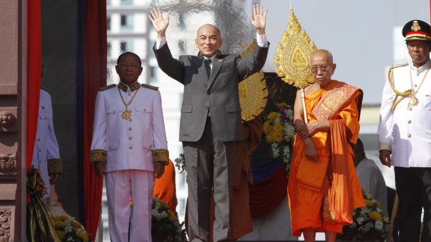 Cambodia's King Norodom Sihamoni waves to well-wishers at Independence Day celebrations in Phnom Penh last week. 