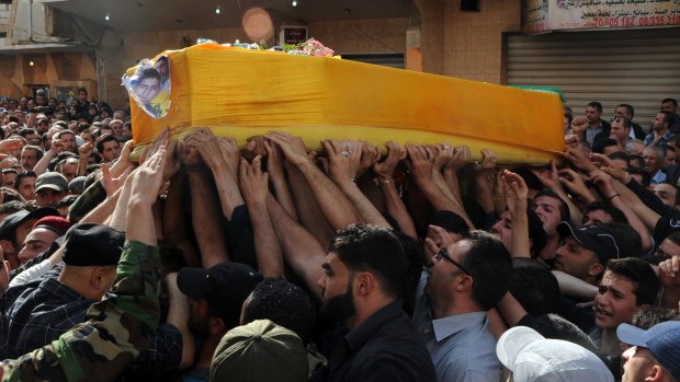 Mourners in Lebanon's Bekaa Valley carry the coffin of Hezbollah fighter Hassan Faisal Shuker, killed fighting Syrian rebels at the Syrian town of Qusayr in 2013.
