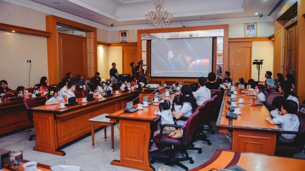 Pupils of the Domba Kecil school watch a scene from <i>Finding Nemo</i> with Jakarta governor Basuki Tjahaja Purnama in city hall in April last year.
