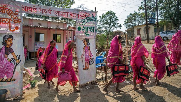 Older women attend school in Phangane, a village in the Indian state of Maharashtra. The school aims to empower the elderly women and break taboos around widowhood. 