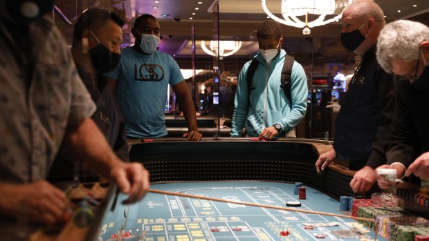 The Bellagio has doubled down on safety, with lots of partitions separating video poker machines, blackjack and poker tables. Tables also had placards saying: "This table has been sanitised."