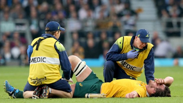 Wallaby down: Kane Douglas is treated for injury during the 2015 Rugby World Cup Final.
