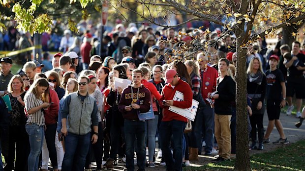 People wait to enter the Trump event at the University of Wisconsin.