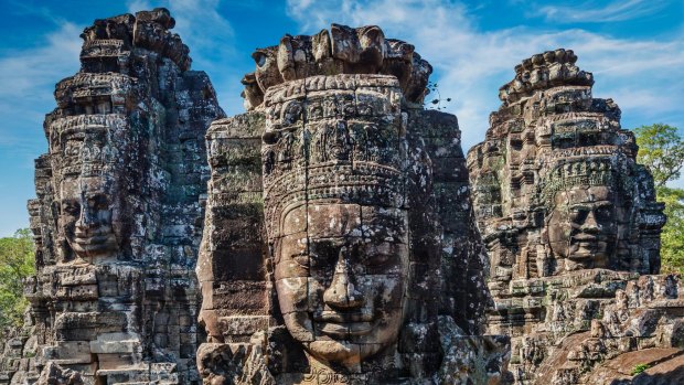 Ancient stone faces of Bayon temple, Angkor, Cambodia.