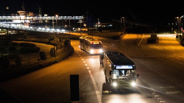 Migrants arriving in Denmark on a ferry from Germany, are carried on busses by police to a nearby sports arena, early on Wednesday.