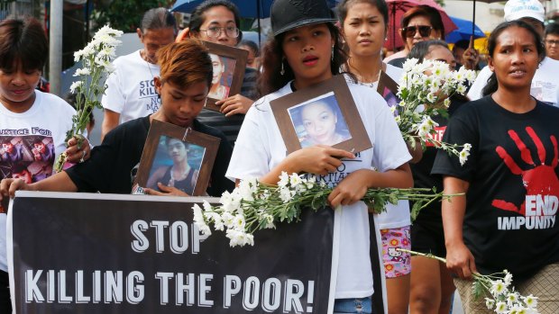 Relatives of three youths killed in Duterte's war on drugs mark the Roman Catholic "Day of the Innocents".