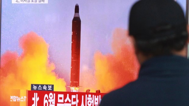 A man in Seoul watches a TV news program on North Korea's missile launches last year..