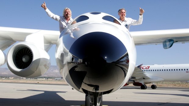 Richard Branson, left, in his concept craft, SpaceShipTwo. 