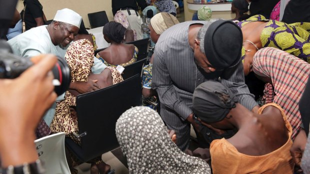 Nigerian Vice President Yemi Osinbajo, right, welcomes some of the freed Chibok school girls in Abuja in October 2016.