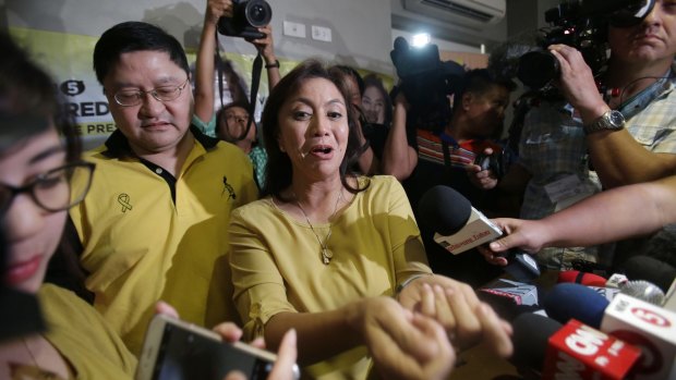 Philippine vice presidential candidate Maria Leonor "Leni" Robredo, centre, in suburban Quezon city on Tuesday.