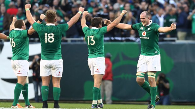 111 years: Ireland players celebrate their historic win over the All Blacks.