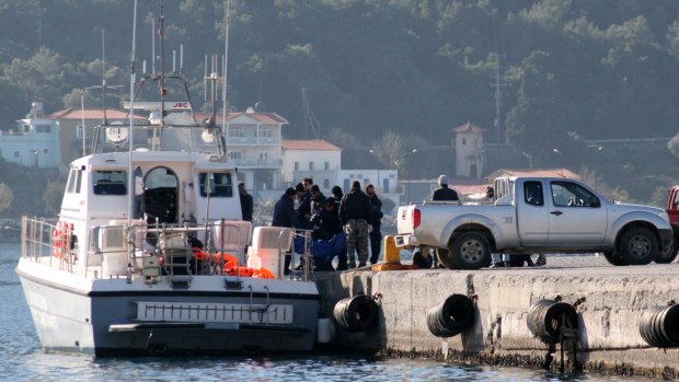Coast guard vessel arrives with the dead bodies of refugees at the port of Vathi on the Greek island of Samos on Thursday. At least 24 people drowned when their boat sank.