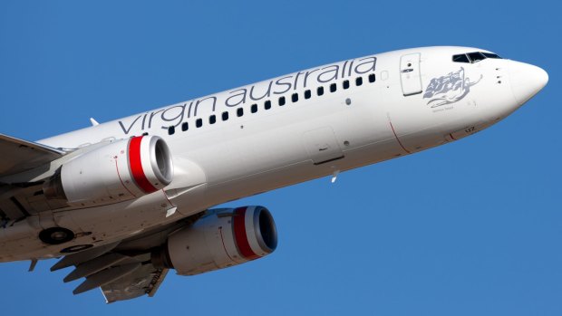 One reader says she was chosen to be bumped from a Virgin Australia flight because she was travelling with only carry-on luggage.