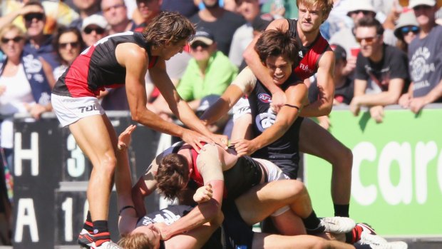 Toughing it out: Carlton's Jack Silvagni is dragged away during a melee.
