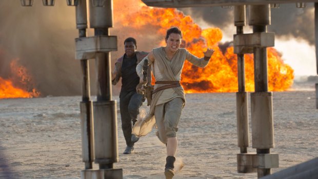 Daisy Ridley as Rey and John Boyega as Finn in a scene from Star Wars: The Force Awakens.