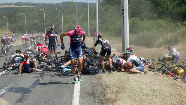Carnage ... Riders pick themselves up after the huge crash during stage three of the tour. 