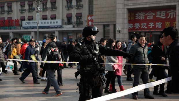 Chinese security forces at Beijing Railway Station in March 2014, after a stabbing attack at the south-western Kunming railway station earlier in the month left 29 dead and more than 130 injured.