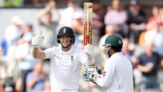 Milestone: England's Joe Root celebrates his 250 against Pakistan during day two of the Second Test in Manchester.