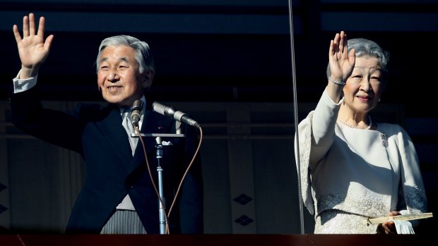 Emperor Akihito and Empress Michiko greet well-wishers gathered to celebrate the Emperor's 76th birthday in 2009.