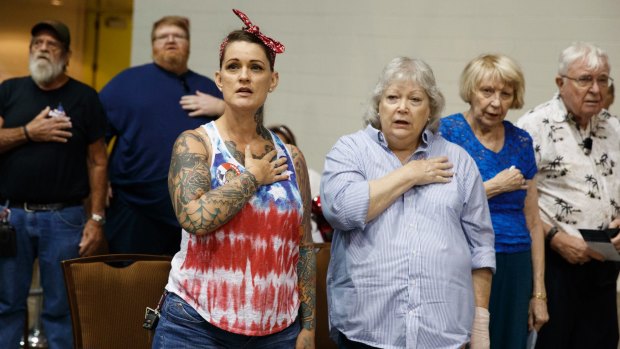Donald Trump supporters stand for the pledge of allegiance at a Florida rally in August 2016.