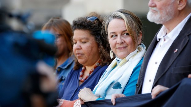''I'm absolutely elated'': Dimity Hawkins (second right), one of the founders of the ICAN, on the steps of Parliament House in Melbourne on Sunday.