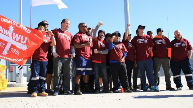 Sacked Hutchison Ports workers have been granted an injunction by the Federal Court, but a security cordon remained at the Sydney work site on Friday.