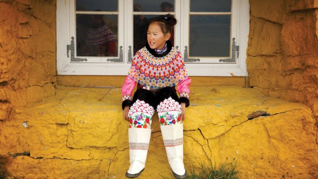 Greenlandic girl in window.