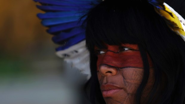 A Guarani woman protests against Brazilian President Michel Temer's plan to restrict land titles to indigenous communitiesin Brasilia on Wednesday.