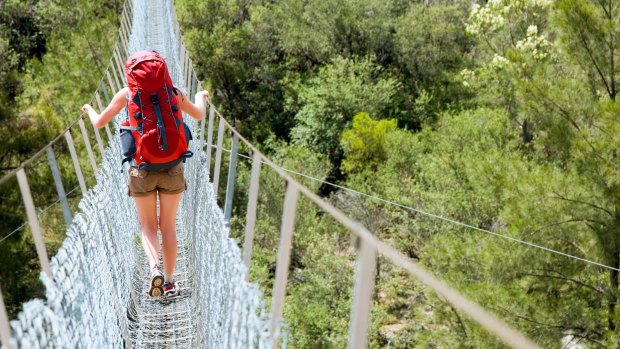 The Bowtell Swing Bridge, a narrow, precarious-looking suspension bridge built in 1991 by the 1st Field Squadron of the Royal Australian Engineers..