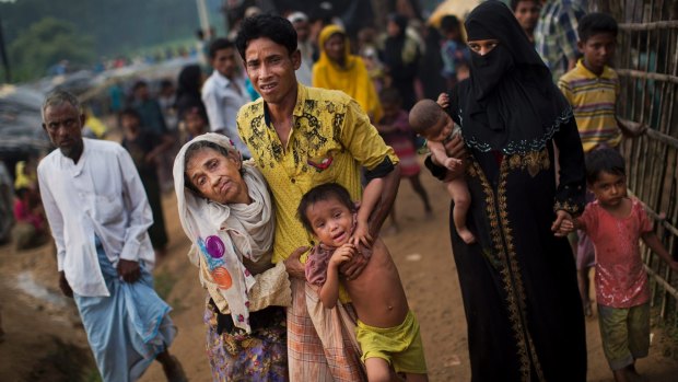 Exhausted Rohingya arrive at Kutupalong refugee camp in Bangladesh. 