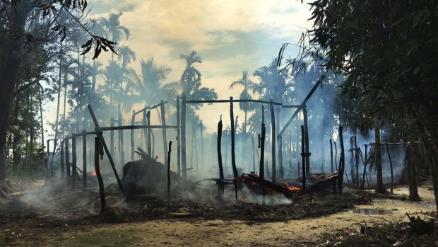 Smoke rises from a burnt house in Gawdu Zara village, northern Rakhine state, Myanmar, in September, after retaliatory attacks for Muslim attacks on security posts. 