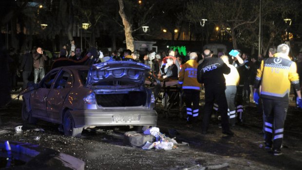 Emergency workers work at the scene of the explosion that killed at least 27 people.