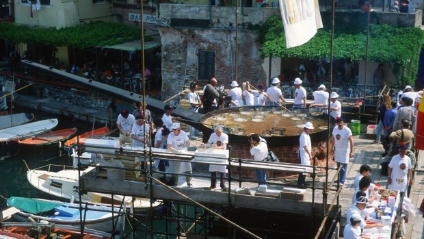 Sagra del Pesce: The famous gourmet festival around a huge fish pan, Camogli, Liguria, Italy.