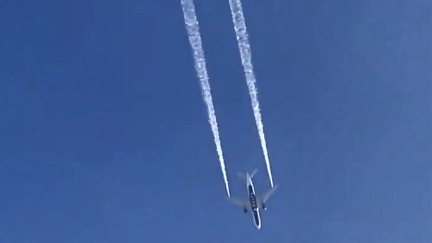 In this image from video, Delta Air Lines Flight 89 to Shanghai, China dumps fuel over Los Angeles before returning to Los Angeles International Airport for an emergency.