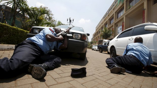 September 2013: policemen take cover near the main entrance of the Westgate shopping mall during the attack that killed at least 67 people.