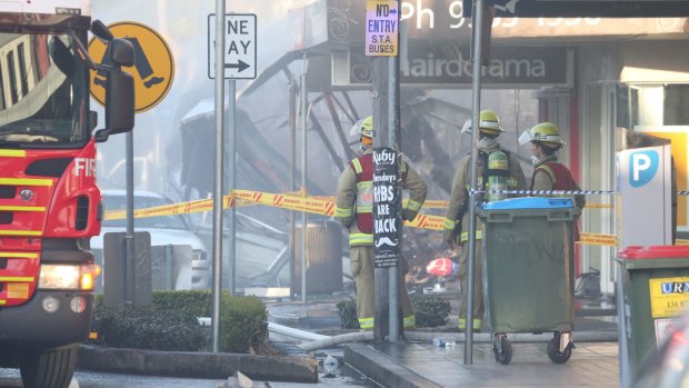 Firefighters outside the Rozelle shop that was destroyed in the explosion.