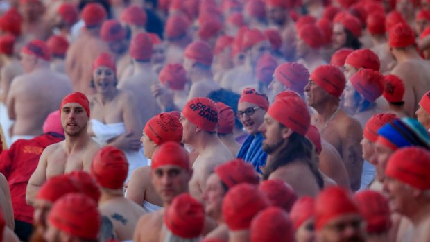 Participants prepare before the Nude Solstice Swim, as part of the Dark Mofo winter festival.