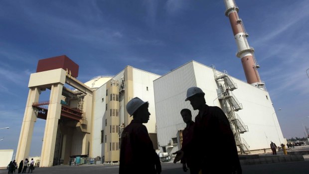 Iranian workers chat in front of the Bushehr nuclear power plant, about 1200 kilometres south of Tehran.