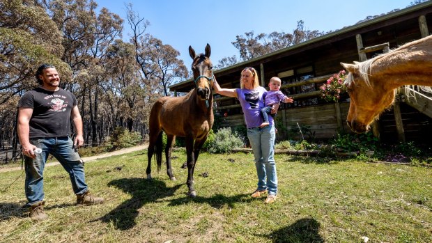 A happy Verne Glenwright with partner Alicia Keenan and daughter Shea and horses. Their home and horses were very lucky to survive when the fire surrounded their property on Musk Gully Road.