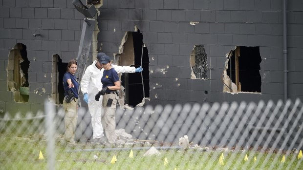 Huge holes were blown out of the side of the nightclub by police during the shooting. 