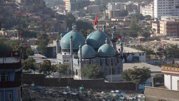 Flags fly on Kart-e-Sakhi shrine in Kabul, Afghanistan.