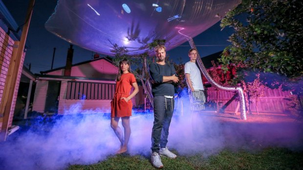 Sara Bosch, Jack May (centre) and Alex Gibson during a preview of Blow-Up, a one-night music and art festival to be held in an inflatable structure in a Brunswick backyard.