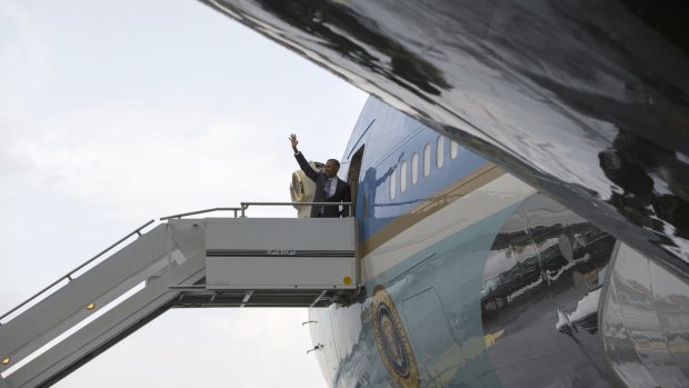 President Barack Obama waves before boarding Air Force One on the final day of his African trip on Tuesday. 
