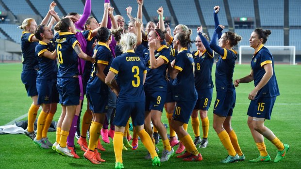 Made it: The Matildas players celebrate after qualifying for the Rio Olympics.