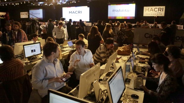 Journalists wait for election results at the headquarters of opposition presidential candidate Mauricio Macri in Buenos Aires.