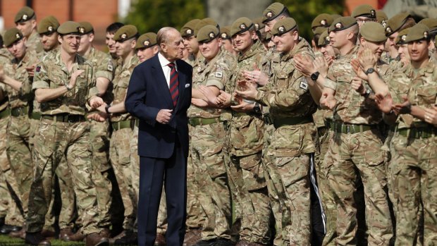 Prince Philip, in his capacity of Colonel, Grenadier Guards, chats with members of the 1st Battalion Grenadier Guards in March.