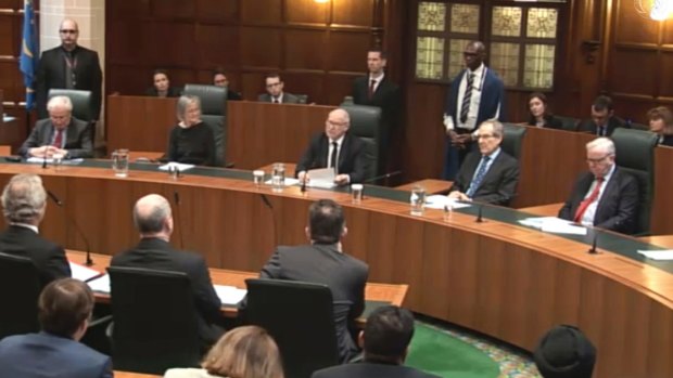 Lord Neuberger, President of the Supreme Court, centre, delivers the judgment in London on Tuesday.