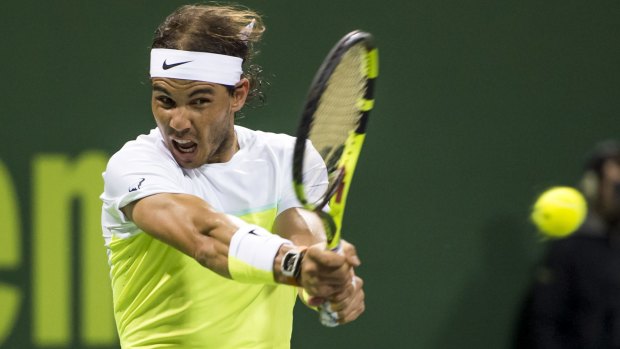 Focused: Rafael Nadal returns the ball to Novak Djokovic.